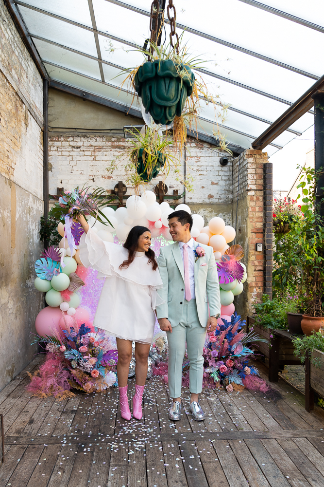 bride and groom celebrating intimate ceremony outside London