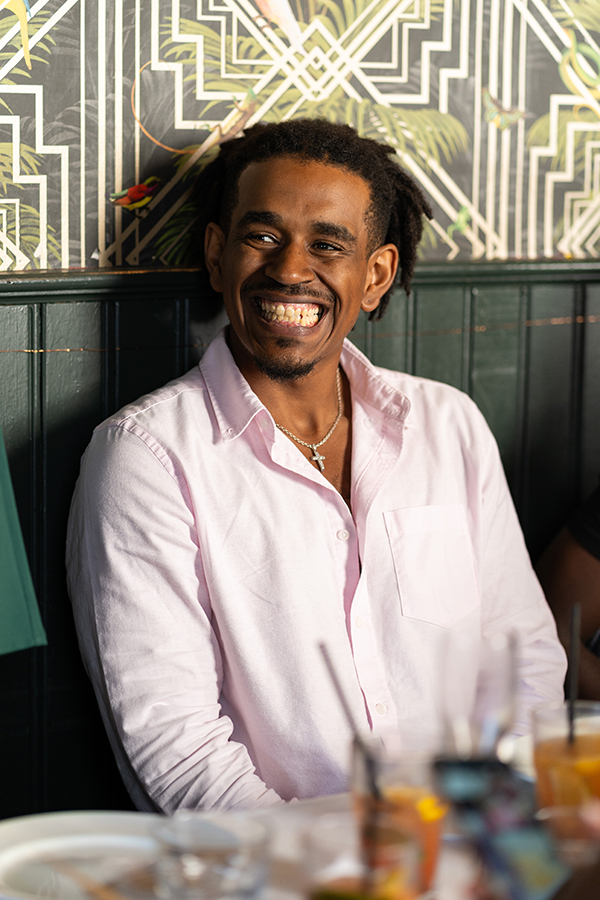 bride's brother smiles during speeches