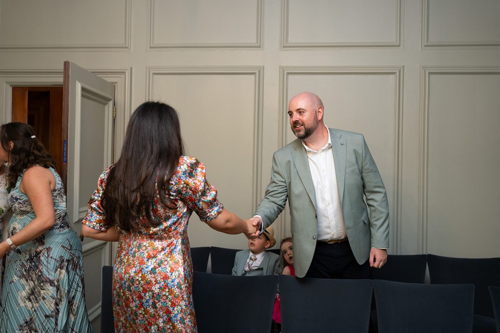 guests greeting one another in the old marylebone town hall soho room